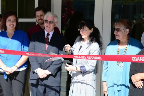 Faculty and chair members gather in front of McLaughin to cut the ribbon for the new residnece halls. (Photo Cred: Robbie Wilkins/The Siskiyou)