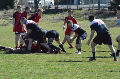 Greg Fillmore tosses the ball out of the ruck to move the Raider offense