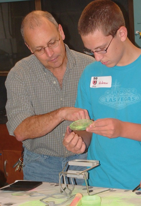 SOU Professor Doug Chapman assists Phoenix High School student Andrew Vargas during the 2010 forensics lab