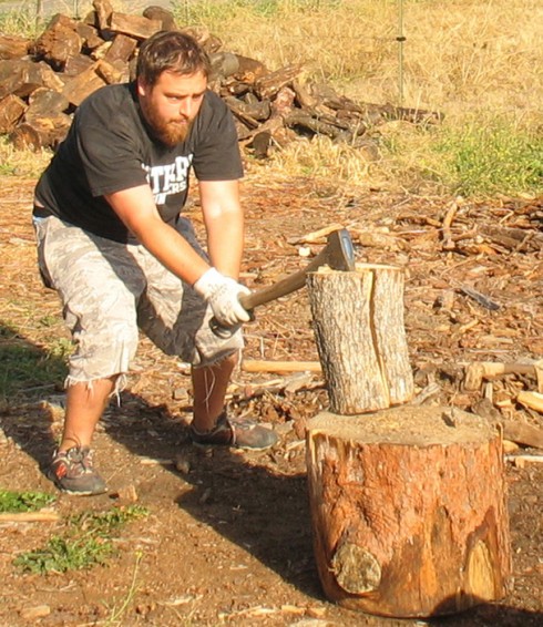 SOU student Edwin Meyer splits wood at one of the Jackson County Fuel Committee’s weekly wood cuts.