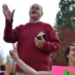 Don Karns (left) preaches in the courtyard of the Stevenson Union while SOU student Brod McLaughlin (right) puts a more positive spin on things.