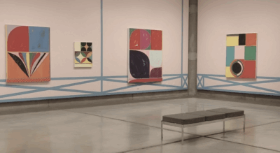 Three abstract paintings by Jason Stopa on display at Schneider Museum of Art