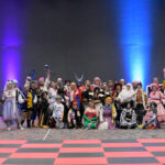 A row of cosplayers in a salon at Kumoricon
