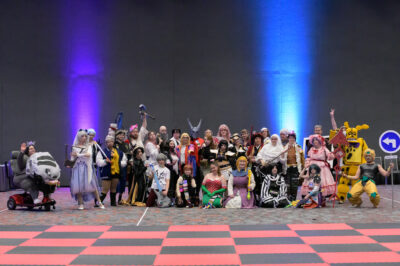 A row of cosplayers in a salon at Kumoricon
