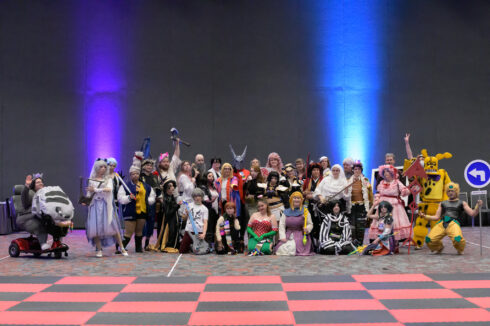 A row of cosplayers in a salon at Kumoricon