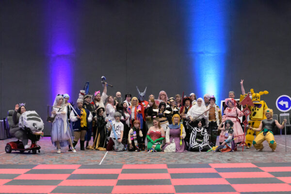 A row of cosplayers in a salon at Kumoricon