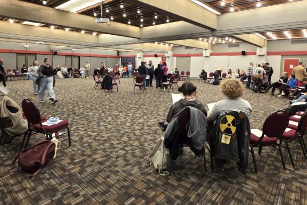 Students seated in a large circle at Southern Oregon University's student union during a forum on youth politics and engagement