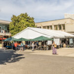 Students gather in the courtyard of the Stevenson Union on Southern Oregon University's Ashland Campus for the Meet Ashland & Beyond Fair, hosted by the University's Office of Student Belonging and Engagement
