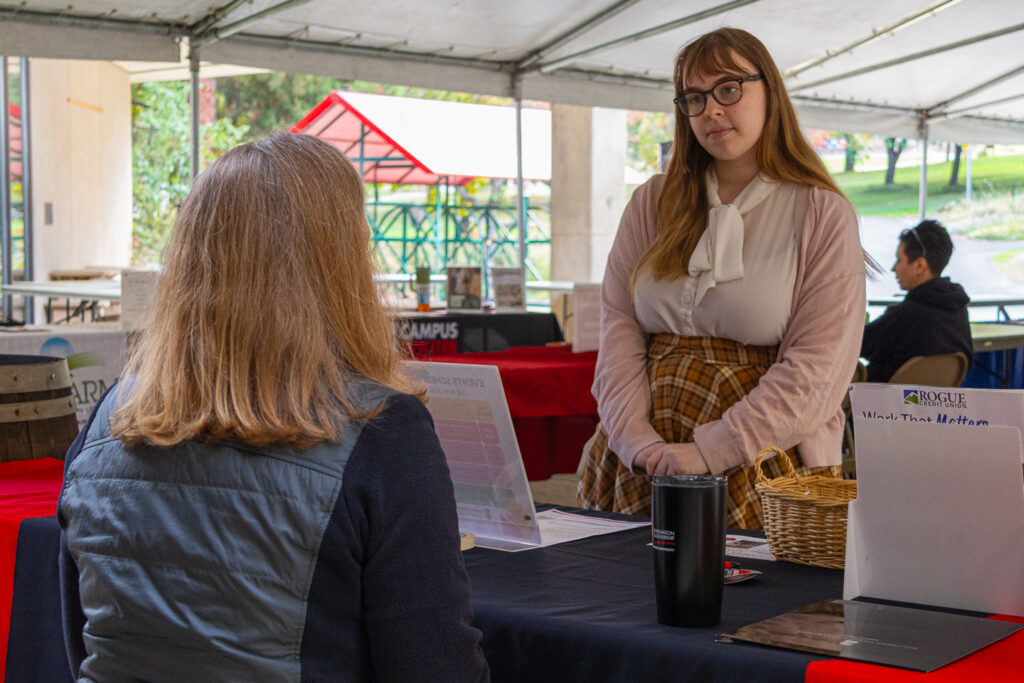 Anna Holbrook (right) attended Thursday's Student Club Fair, representing Table Top Tavern, and returned for Friday's Student Job.